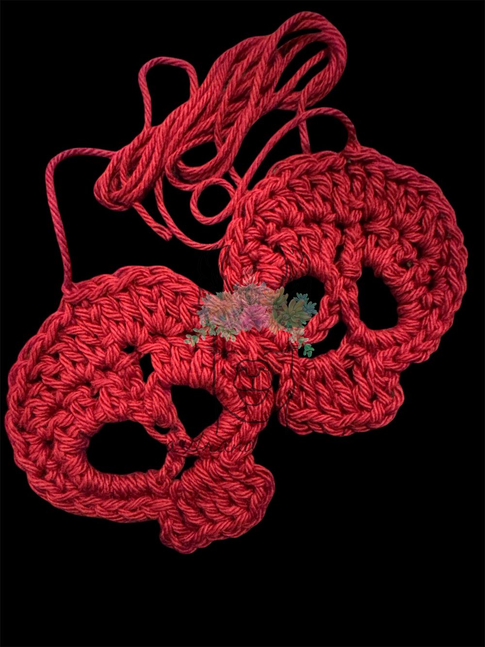 A Pair of Crocheted Skulls-Bordeaux